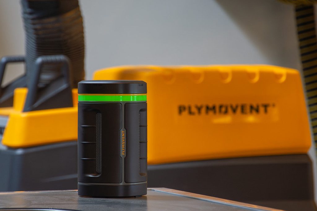 Plymovent AeroGuard air quality monitor on a workshop table